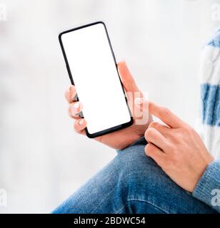 smartphone with white screen in woman hands Stock Photo