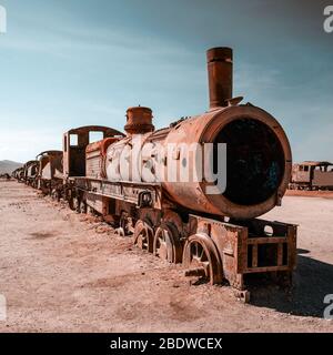Old rusty steam train near Uyuni in Bolivia. Cemetery trains. Stock Photo