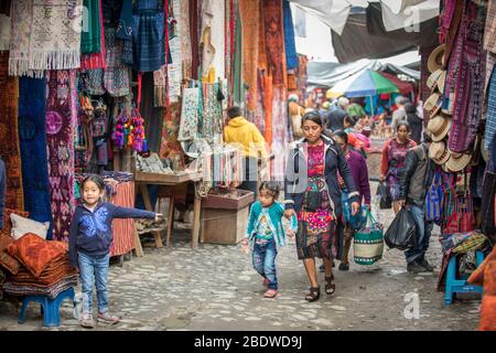 chichicastenango, Guatemala, 27th February 2020: mayan people at the traditional market selling and buying crafts Stock Photo