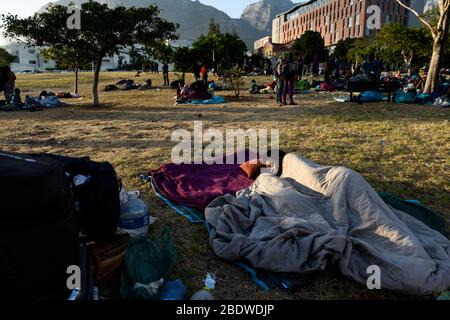 African refugees and asylum seekers sleep in a park after their eviction from occupying Cape Town's Greenmarket Square protesting xenophobia Stock Photo