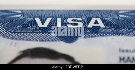 Macro of Usa visa stamp in passport. Travel to america theme Stock Photo