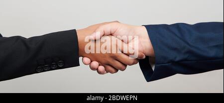 Handshake of woman and men isolated close up view Stock Photo
