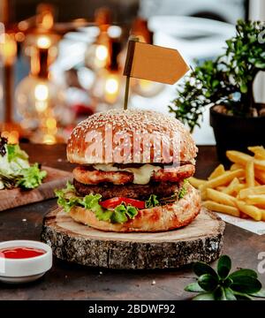 chicken burger with french fries on the table Stock Photo