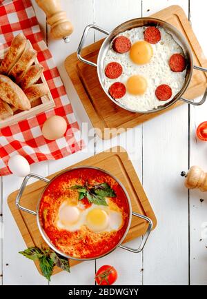 fried sausages with eggs on the table Stock Photo