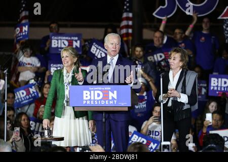 (FILE) Joe Biden's First Official Day As The De Facto 2020 Democratic Presidential Nominee. Vermont Senator Bernie Sanders' decision to quit the race on Wednesday means the former vice president can now fully devote his time and energy to the general election against President Donald Trump. BALDWIN HILLS, LOS ANGELES, CALIFORNIA, USA - MARCH 03: Former Vice President Joe Biden, 2020 Democratic presidential candidate, speaks while his wife Jill Biden, left, and sister Valerie Biden, right, stand during the Jill and Joe Biden 2020 Super Tuesday Los Angeles Rally held at the Baldwin Hills Recreat Stock Photo