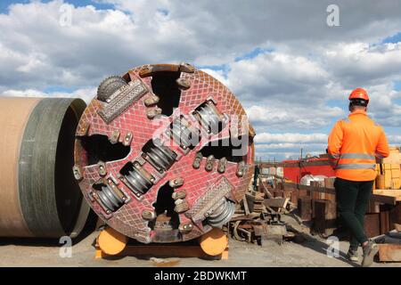 Tunnel boring machine on construction site building metro. Heavy machine on construction site with workers Stock Photo