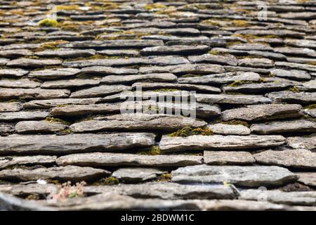 Old-fashioned roof tiles on Arlington Row at Arlington in the parish of Bibury, Gloucestershire, England Stock Photo