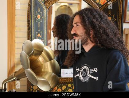Portrait of a young man with dark long ,curly hair in Isfahan, Iran,Persia, Middle East Stock Photo