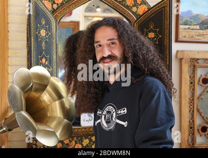Portrait of a young man with dark long ,curly hair in Isfahan, Iran,Persia, Middle East Stock Photo