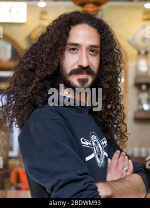 Portrait of a young man with dark long ,curly hair in Isfahan, Iran,Persia, Middle East Stock Photo