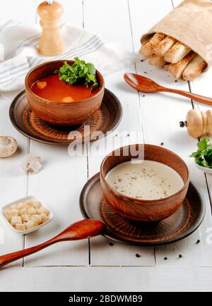 tomato and mushroom soups on the table Stock Photo