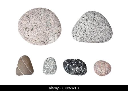 Pebble stones on white background isolated close up top view, set of smooth sea pebbles, rubble collection, different spotted and striped gray, black Stock Photo