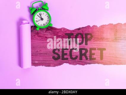 Conceptual hand writing showing Top Secret. Concept meaning protected by a high degree of secrecy Highly confidential Stock Photo