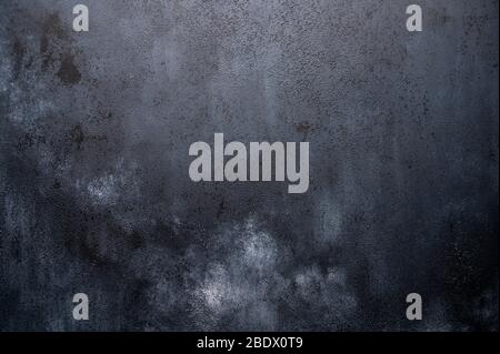 Dark background made of wood with imitation of light chalk stains for design Stock Photo