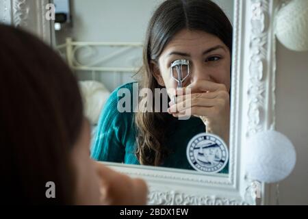 Teenage girl putting on make-up during Covid19 confinement in Catalonia, Spain