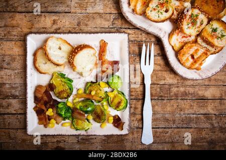 Homemade bruschetta on a heart shaped plate with veggies Stock Photo