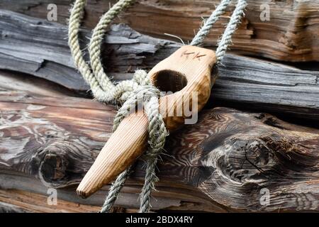 Wooden buckle with ropes used in traditional way of wood logs transport. Stock Photo