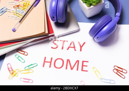Desk top with Words stay at home. Coronavirus Pandemic Protection Concept. Stay safe, concept of self quarantine at home as preventative measure