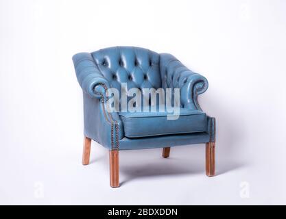 Classic Dark blue leather armchair isolated on white background with clipping path. Stock Photo