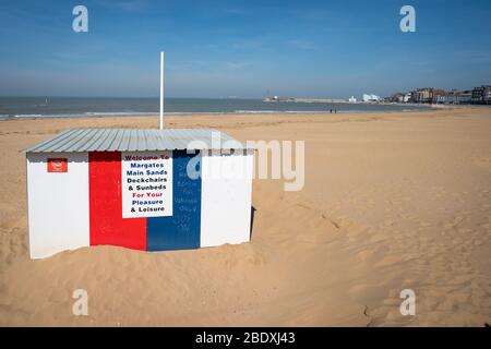 Chalk writing telling people to stay away from Margate Beach is visible on an empty beach in Margate, Kent, during the Easter bank holiday weekend, as the UK continues in lockdown to help curb the spread of the coronavirus. Stock Photo