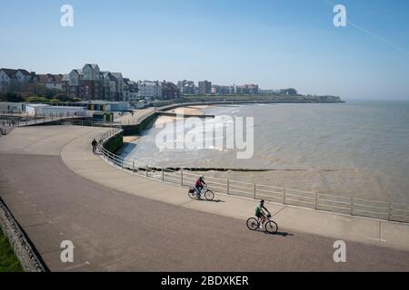 People ride bikes near Margate Beach, Kent, during the Easter bank holiday weekend, as the UK continues in lockdown to help curb the spread of the coronavirus. Stock Photo