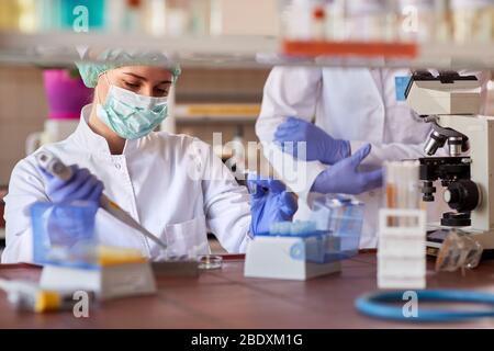 Female microbiologist working in medical lab Stock Photo