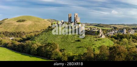 Evening over Corfe Castle (built 11th C. by William the Conqueror), Corfe Castle, Dorset, England, UK Stock Photo