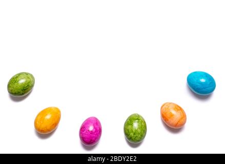 Border of easter eggs in different colors as half circle isolated on white background Stock Photo