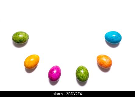 Border of easter eggs in different colors as half circle isolated on white background Stock Photo