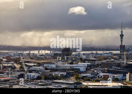 Auckland, New Zealand - Jul 03, 2017: A general view of Auckland and the Sky Tower from Mount Eden looking towards Waitemata Harbour and North Shore a Stock Photo