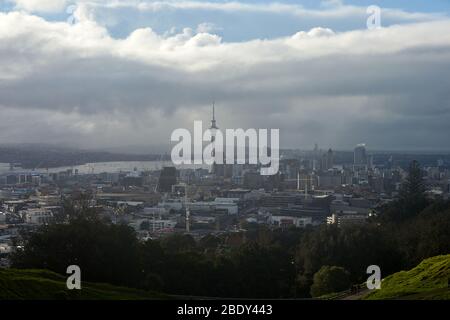 Auckland, New Zealand - Jul 03, 2017: A general view of Auckland and the Sky Tower from Mount Eden looking towards North Shore as a storm blows in acr Stock Photo