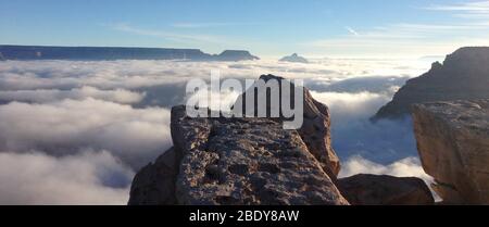 A rare total cloud inversion was seen on November 29, 2013 by visitors to Grand Canyon National Park. This view is from Mather Point on the South Rim. Cloud inversions are formed through the interaction of warm and cold air masses. Stock Photo