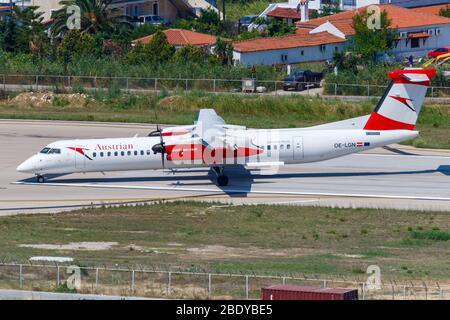 Skiathos, Greece – July 27, 2019: Austrian Airlines Bombardier DHC-8-400 airplane at Skiathos airport (JSI) in Greece. Stock Photo