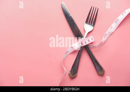 fork, knife and measuring tape. Diet concept Stock Photo