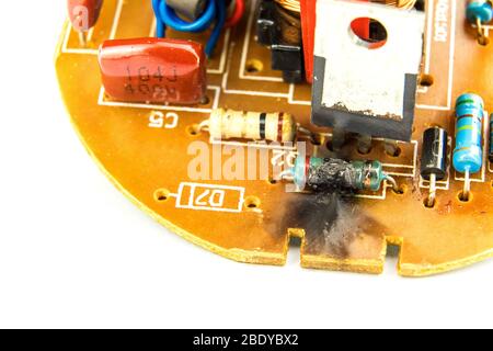 Fire in electronics. Damaged electronic component LED bulbs.  Faulty electronics. Electric resistance. Stock Photo