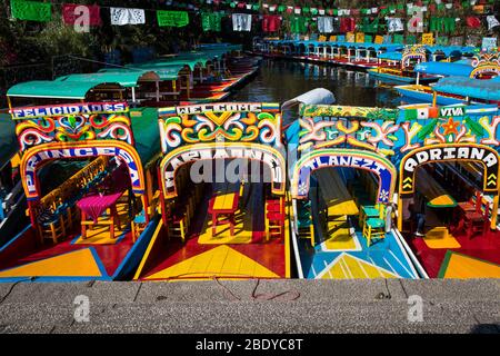 Colorful boats on the canals of Xochimilco in Mexico City, Mexico Stock Photo
