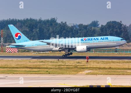 Beijing, China – October 2, 2019: Korean Air Boeing 777-200ER airplane at Beijing Capital airport (PEK) in China. Boeing is an American aircraft manuf Stock Photo