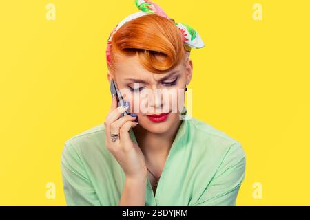 Bad news. Sad woman on cell phone. Closeup portrait headshot of beautiful upset unhappy serious girl student talking on mobile yellow wall background. Stock Photo