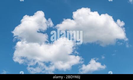 White clouds in the blue sky. Stock Photo