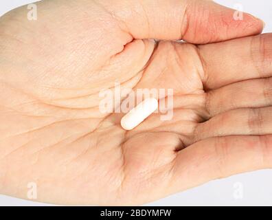 Probiotic in the Palm of Hands Stock Photo