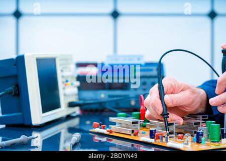 PCB witch microcontroller in electronics laboratory Stock Photo