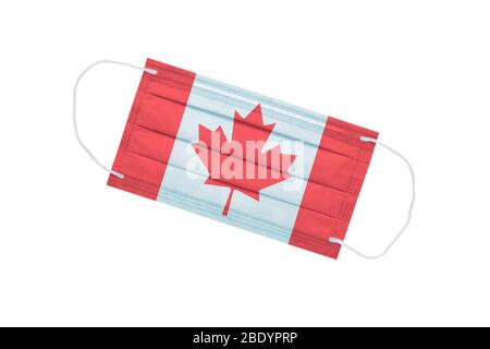 Medical face mask with Canada flag on the front side isolated on a white background. Canada pandemic concept. attribute of coronavirus outbreak in Can Stock Photo