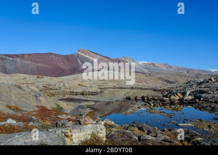 Greenland landscape with beautiful coloured rocks. Stock Photo