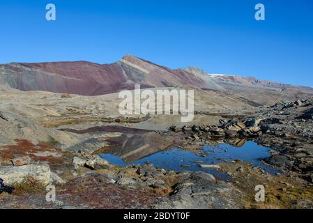 Greenland landscape with beautiful coloured rocks. Stock Photo