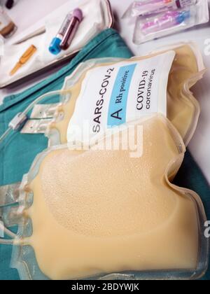 Plasma bag with antibodies from people cured of SARS-COV-2 Covid-19 prepared in a hospital, conceptual image Stock Photo