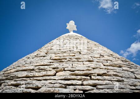 view of the typical conic roof of trullo buildings. Alberobello,  Puglia. Italy Stock Photo