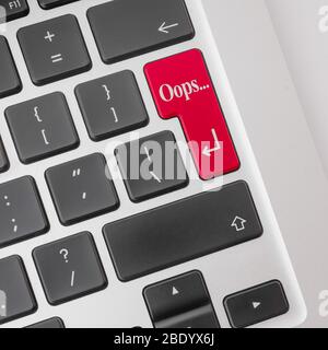 Oops on a red key on computer keyboard. Stock Photo