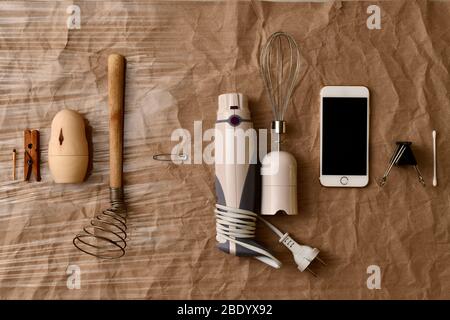 https://l450v.alamy.com/450v/2bdyx92/flat-lay-evolution-materials-wood-plastic-metal-pin-in-the-center-unchanged-on-a-paper-plastic-background-2bdyx92.jpg