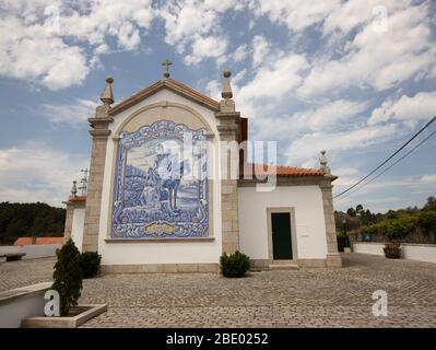 Saint Martinho in detailed blue azulejo tiles on the gable wall at Freixieiro de Soutelo church dating back to 1258, in Viana do Castelo, Portugal . Stock Photo