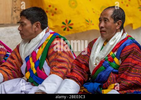 Bhutan, Punakha Dzong. Punakha Drubchen Festival, performers in traditional attire. Stock Photo